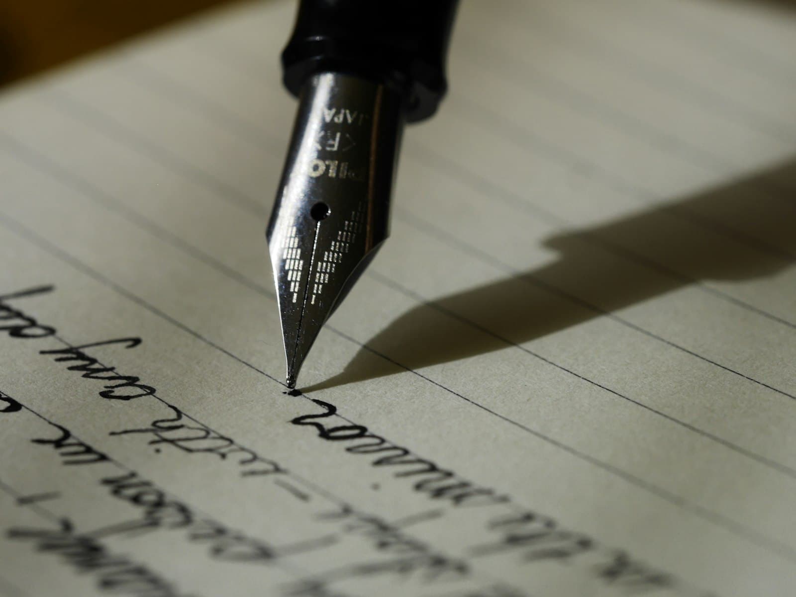 Writing content — fountain pen on paper